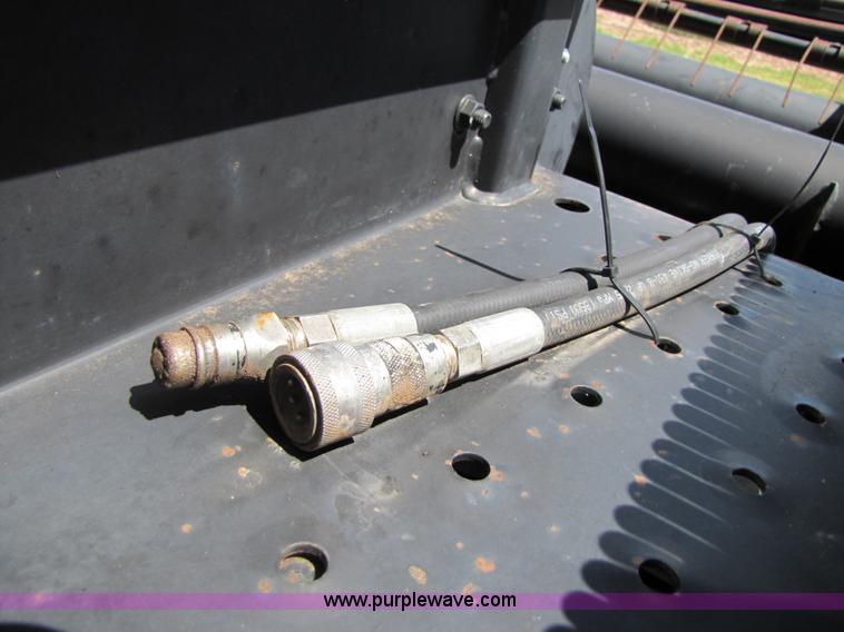 image for item 3142 1998 Mac Don self-propelled windrower with Mac Don 16'auger head