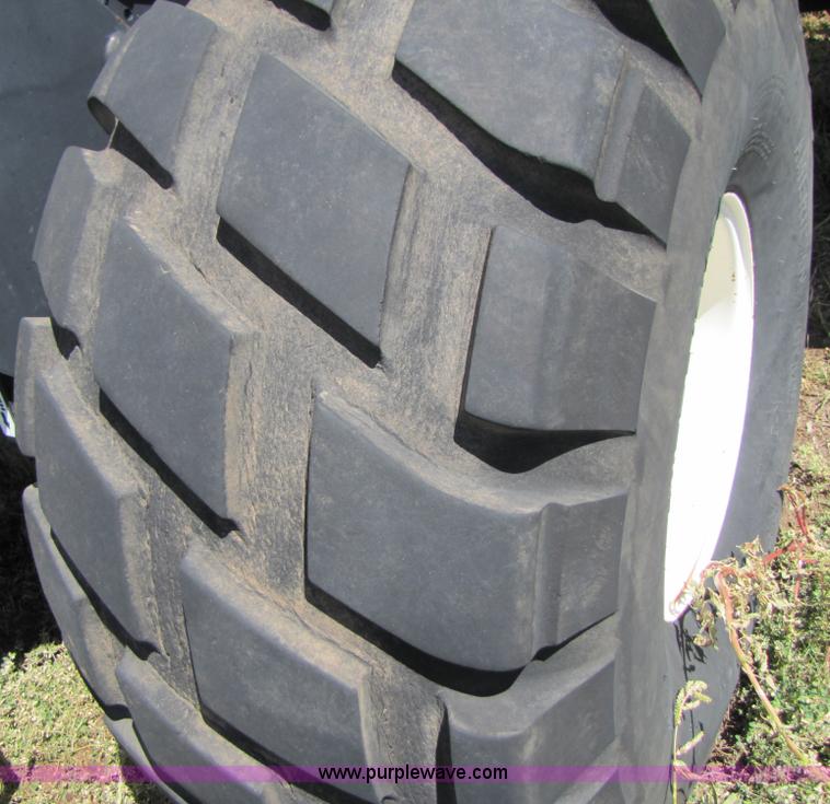 image for item 3142 1998 Mac Don self-propelled windrower with Mac Don 16'auger head