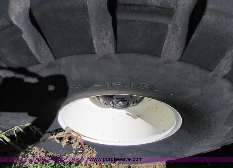 image for item 3142 1998 Mac Don self-propelled windrower with Mac Don 16'auger head