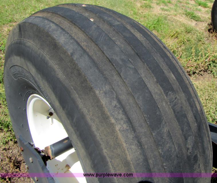 image for item 3142 1998 Mac Don self-propelled windrower with Mac Don 16'auger head