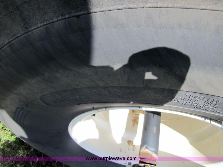 image for item 3142 1998 Mac Don self-propelled windrower with Mac Don 16'auger head