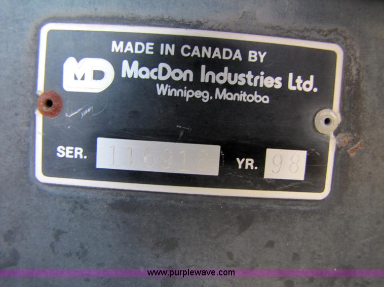 image for item 3142 1998 Mac Don self-propelled windrower with Mac Don 16'auger head