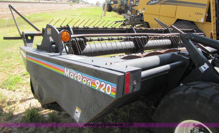 image for item 3142 1998 Mac Don self-propelled windrower with Mac Don 16'auger head