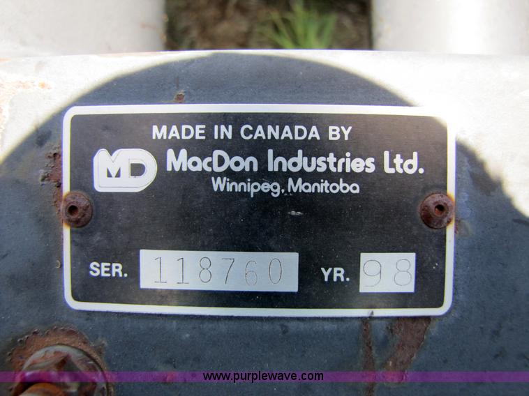 image for item 3142 1998 Mac Don self-propelled windrower with Mac Don 16'auger head