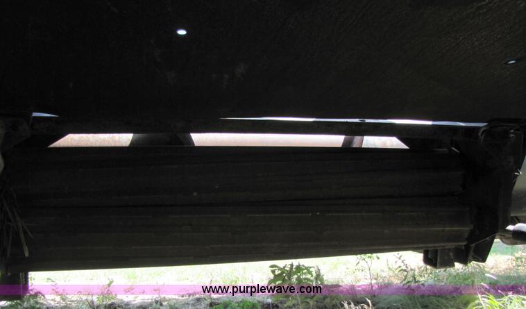 image for item 3142 1998 Mac Don self-propelled windrower with Mac Don 16'auger head