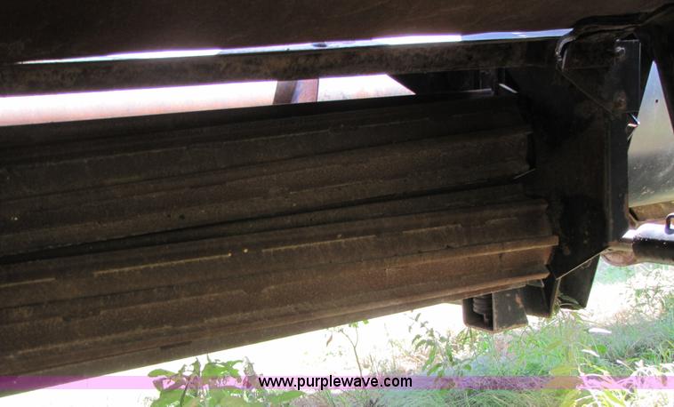 image for item 3142 1998 Mac Don self-propelled windrower with Mac Don 16'auger head