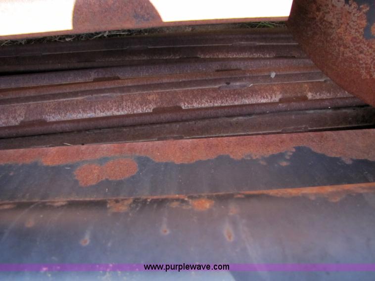 image for item 3142 1998 Mac Don self-propelled windrower with Mac Don 16'auger head