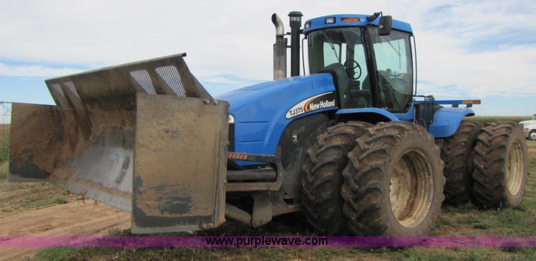 image for item 3143 2006 New Holland TJ375 4WD tractor with Grouser six-way blade