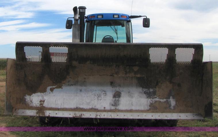 image for item 3143 2006 New Holland TJ375 4WD tractor with Grouser six-way blade