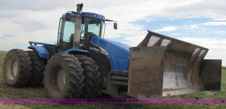 image for item 3143 2006 New Holland TJ375 4WD tractor with Grouser six-way blade