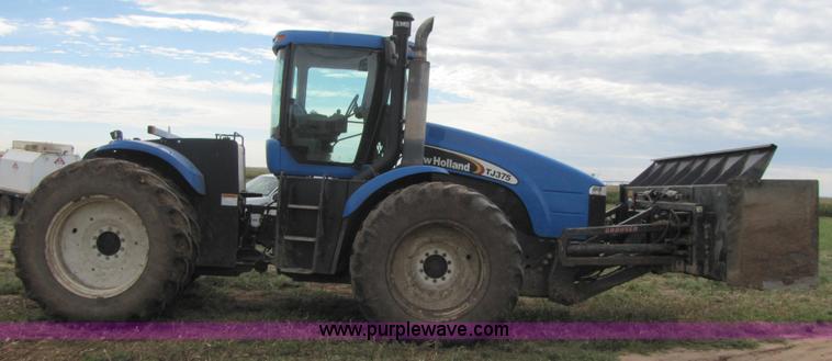 image for item 3143 2006 New Holland TJ375 4WD tractor with Grouser six-way blade