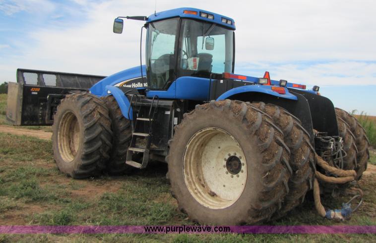image for item 3143 2006 New Holland TJ375 4WD tractor with Grouser six-way blade