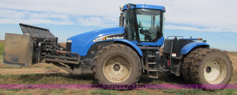image for item 3143 2006 New Holland TJ375 4WD tractor with Grouser six-way blade