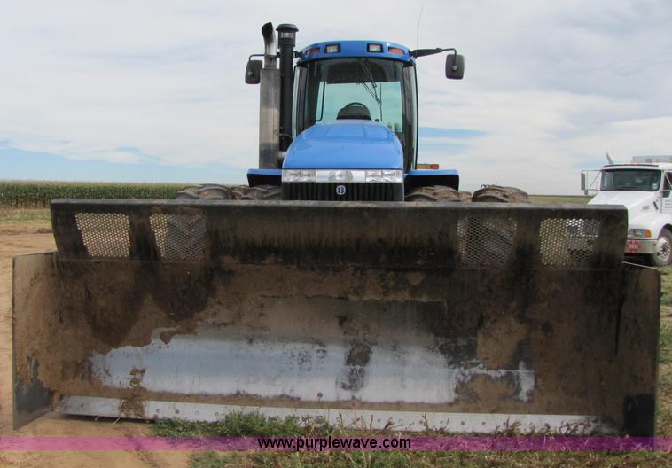 image for item 3143 2006 New Holland TJ375 4WD tractor with Grouser six-way blade