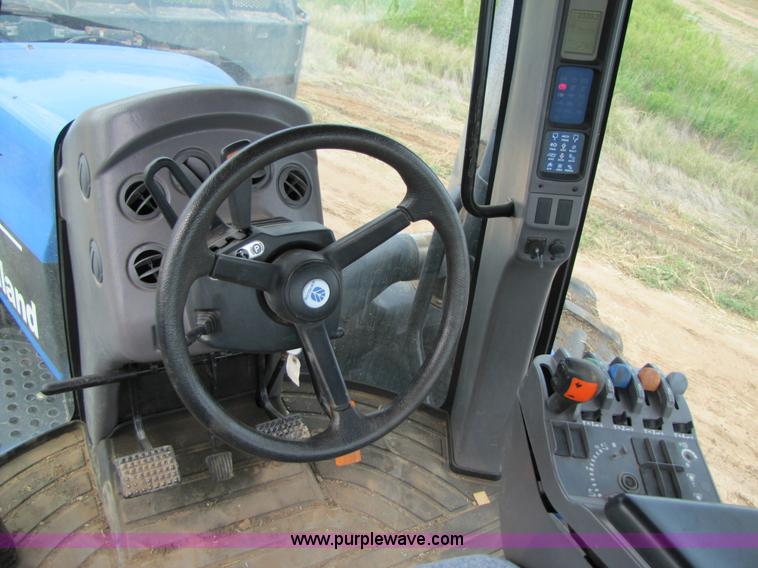 image for item 3143 2006 New Holland TJ375 4WD tractor with Grouser six-way blade