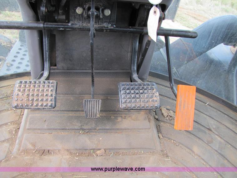 image for item 3143 2006 New Holland TJ375 4WD tractor with Grouser six-way blade