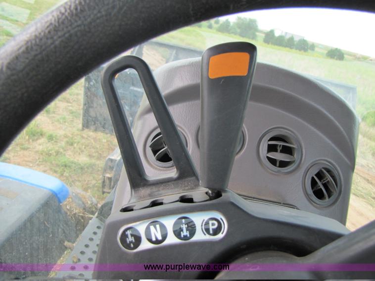 image for item 3143 2006 New Holland TJ375 4WD tractor with Grouser six-way blade