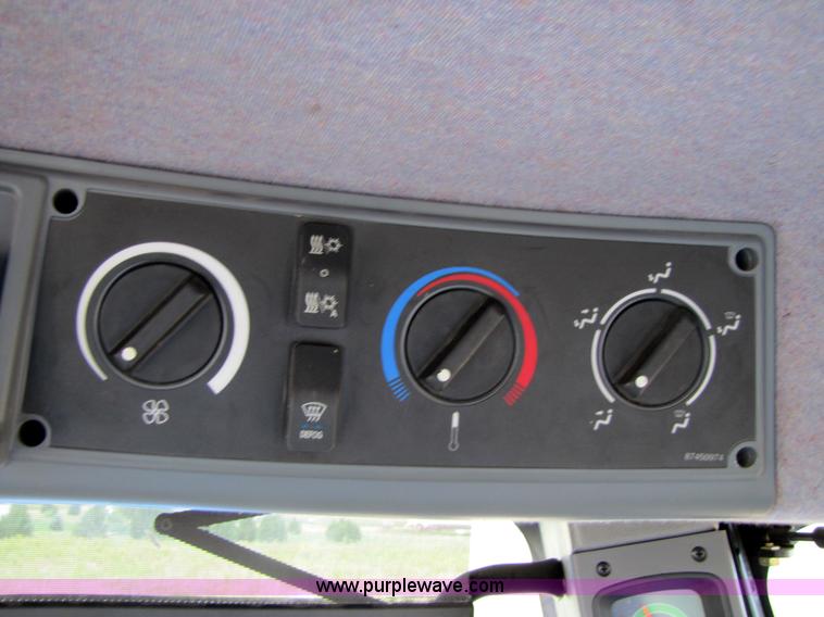 image for item 3143 2006 New Holland TJ375 4WD tractor with Grouser six-way blade