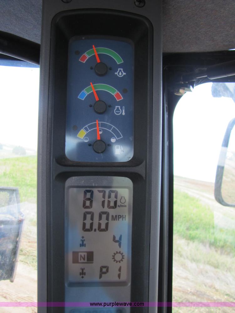 image for item 3143 2006 New Holland TJ375 4WD tractor with Grouser six-way blade