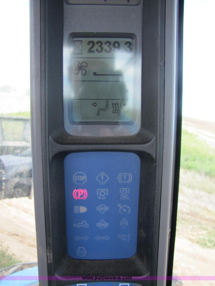 image for item 3143 2006 New Holland TJ375 4WD tractor with Grouser six-way blade