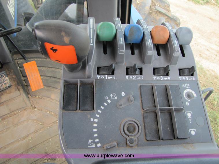 image for item 3143 2006 New Holland TJ375 4WD tractor with Grouser six-way blade