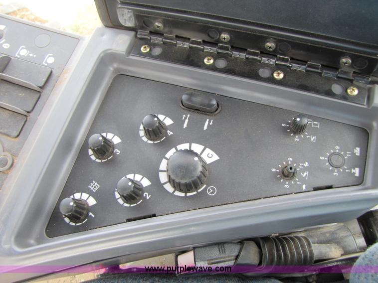 image for item 3143 2006 New Holland TJ375 4WD tractor with Grouser six-way blade