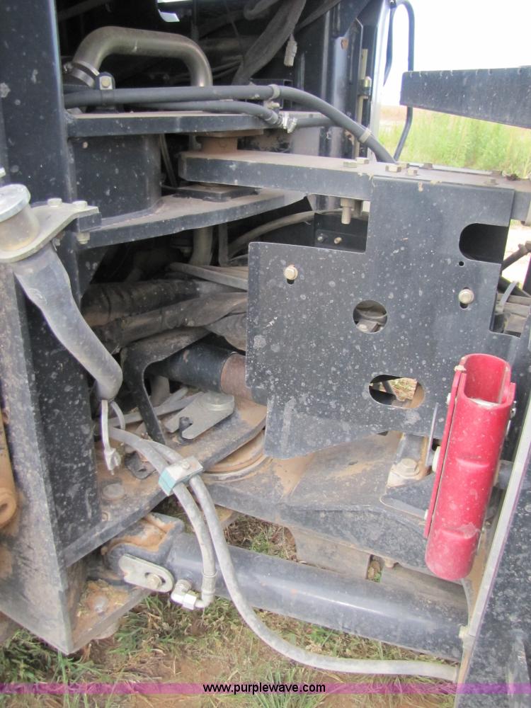 image for item 3143 2006 New Holland TJ375 4WD tractor with Grouser six-way blade