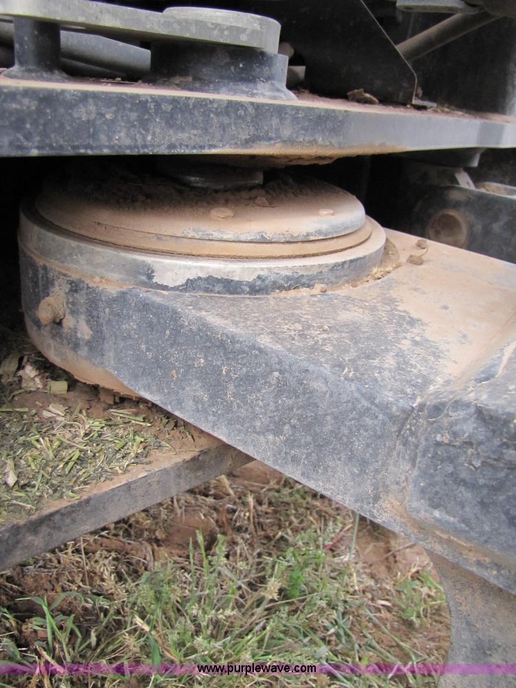 image for item 3143 2006 New Holland TJ375 4WD tractor with Grouser six-way blade