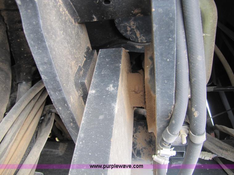 image for item 3143 2006 New Holland TJ375 4WD tractor with Grouser six-way blade