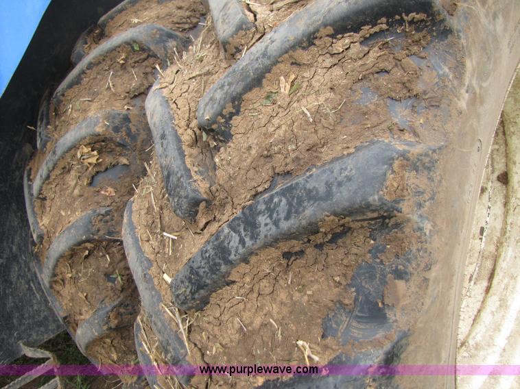 image for item 3143 2006 New Holland TJ375 4WD tractor with Grouser six-way blade