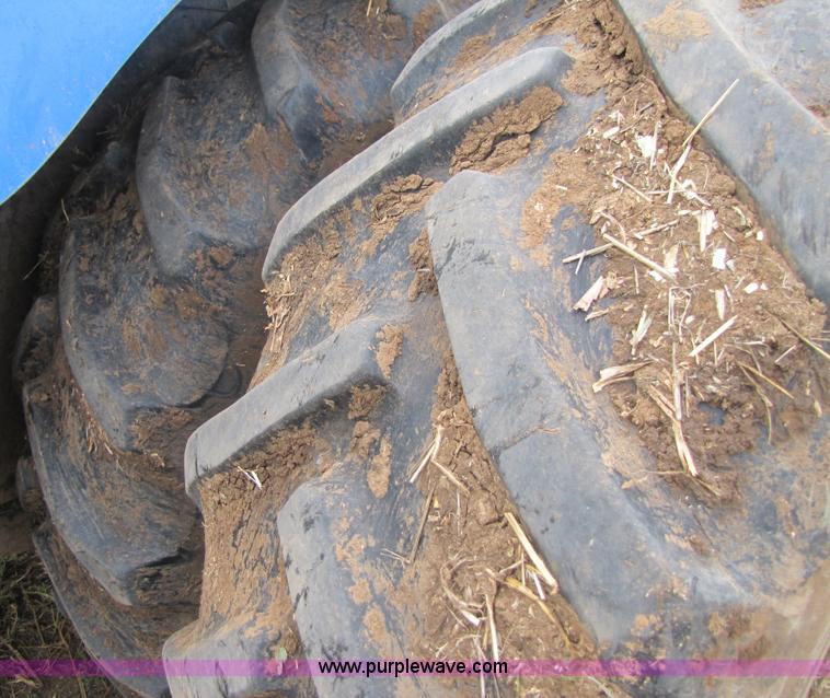 image for item 3143 2006 New Holland TJ375 4WD tractor with Grouser six-way blade