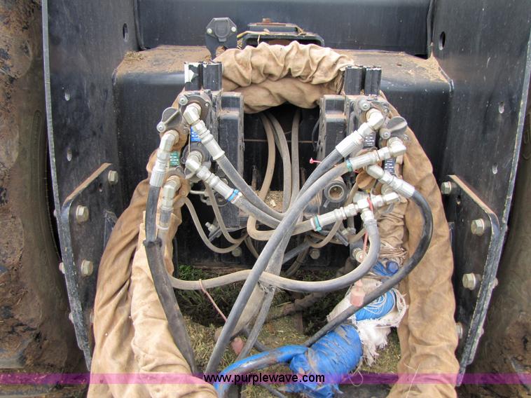 image for item 3143 2006 New Holland TJ375 4WD tractor with Grouser six-way blade