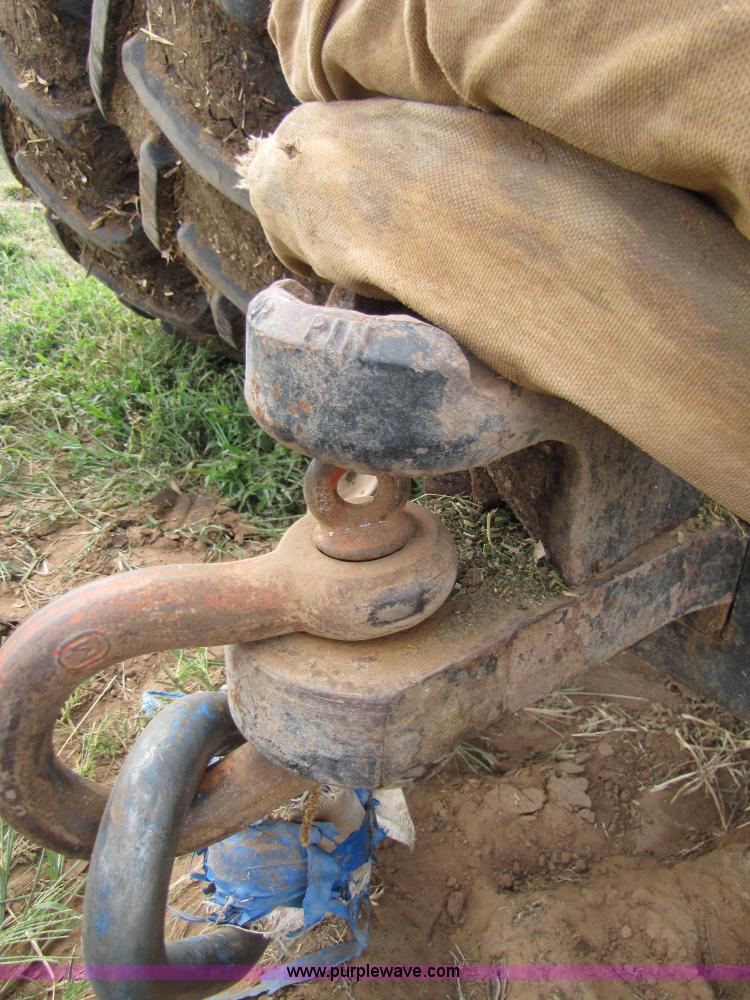 image for item 3143 2006 New Holland TJ375 4WD tractor with Grouser six-way blade