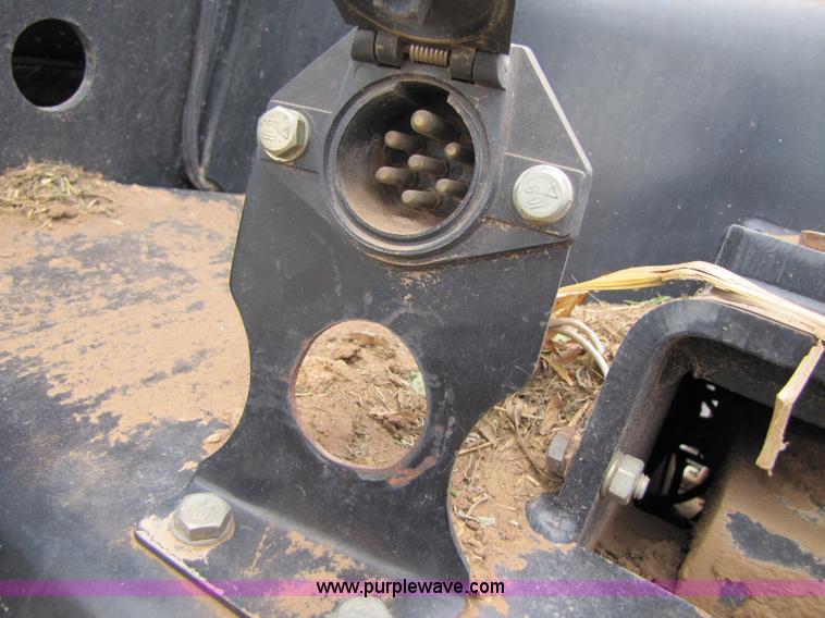 image for item 3143 2006 New Holland TJ375 4WD tractor with Grouser six-way blade