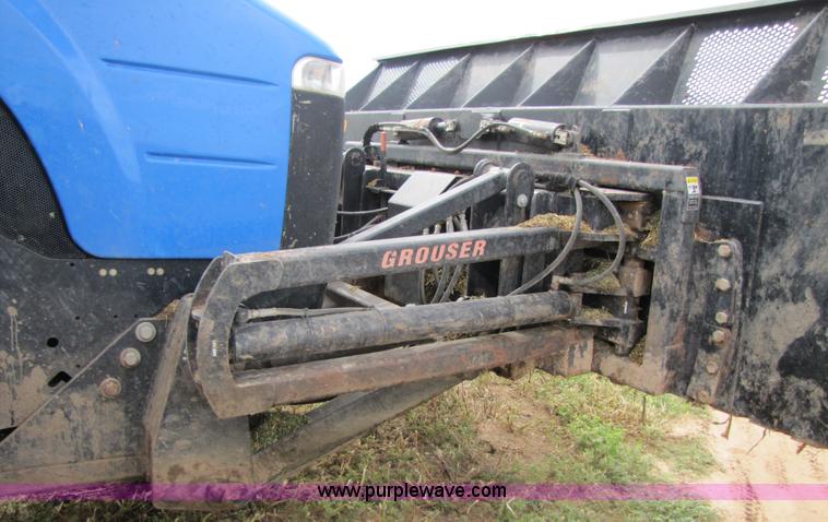 image for item 3143 2006 New Holland TJ375 4WD tractor with Grouser six-way blade