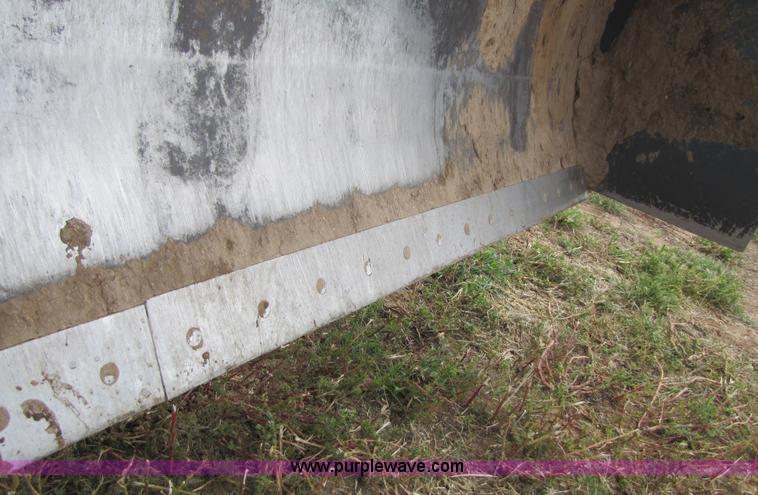 image for item 3143 2006 New Holland TJ375 4WD tractor with Grouser six-way blade