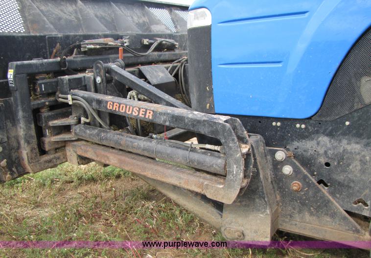 image for item 3143 2006 New Holland TJ375 4WD tractor with Grouser six-way blade