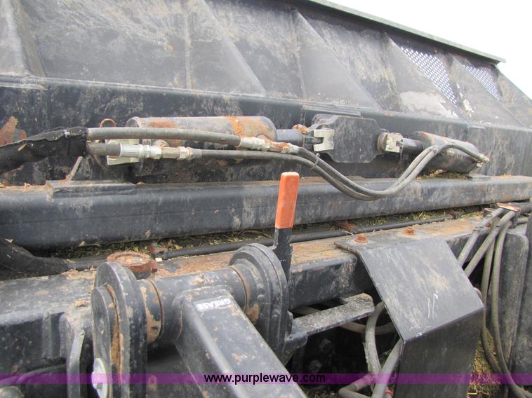 image for item 3143 2006 New Holland TJ375 4WD tractor with Grouser six-way blade