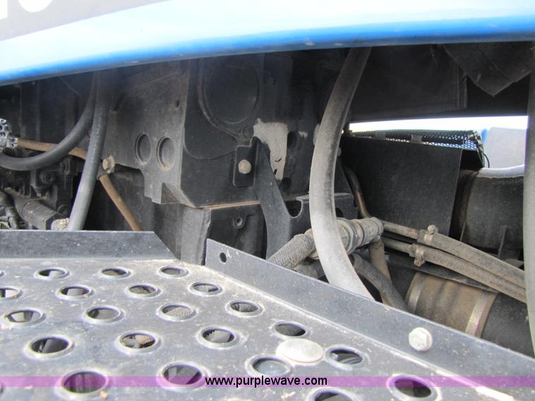 image for item 3143 2006 New Holland TJ375 4WD tractor with Grouser six-way blade