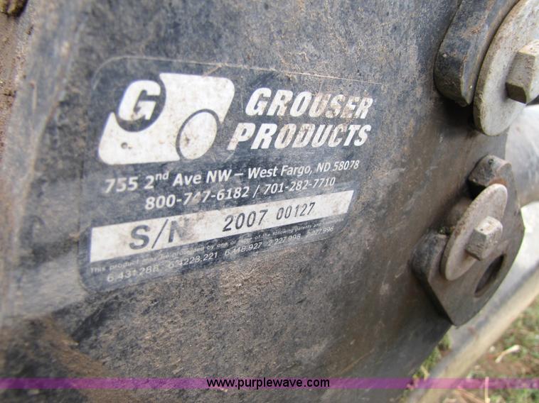 image for item 3143 2006 New Holland TJ375 4WD tractor with Grouser six-way blade