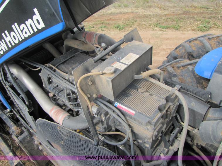 image for item 3143 2006 New Holland TJ375 4WD tractor with Grouser six-way blade