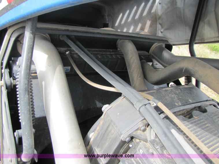 image for item 3143 2006 New Holland TJ375 4WD tractor with Grouser six-way blade