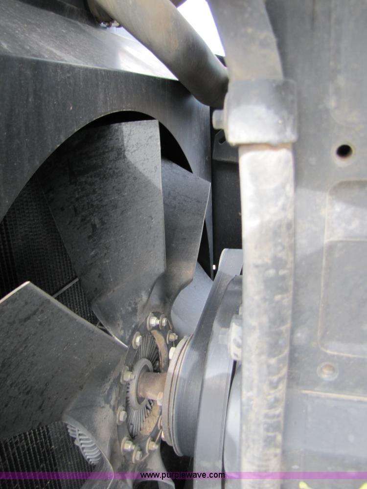 image for item 3143 2006 New Holland TJ375 4WD tractor with Grouser six-way blade