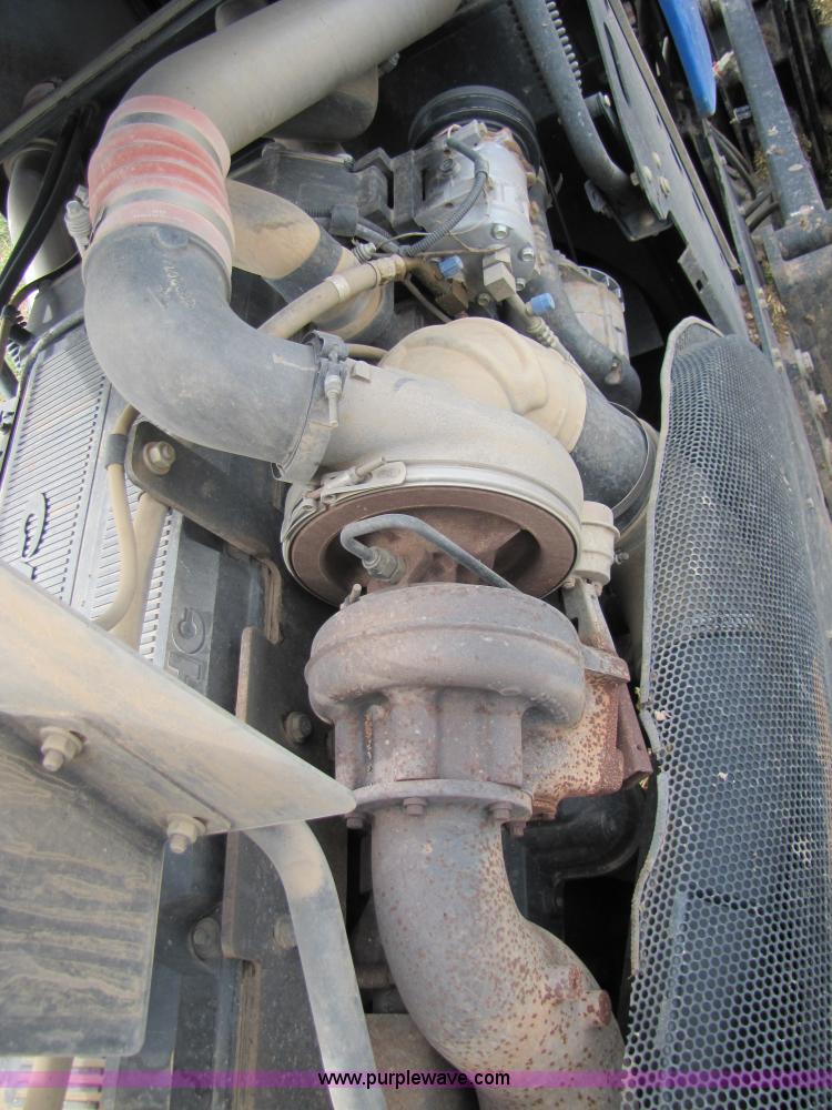 image for item 3143 2006 New Holland TJ375 4WD tractor with Grouser six-way blade