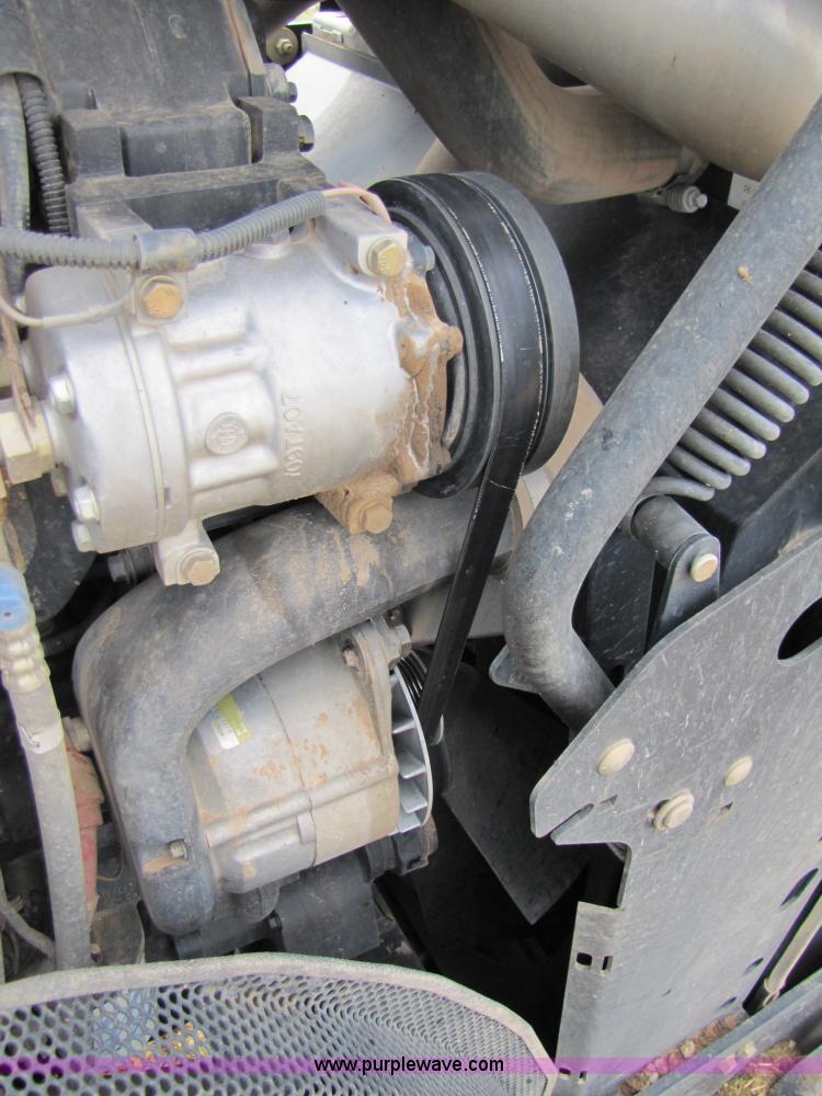 image for item 3143 2006 New Holland TJ375 4WD tractor with Grouser six-way blade