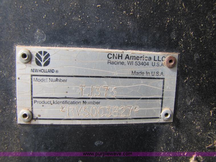 image for item 3143 2006 New Holland TJ375 4WD tractor with Grouser six-way blade