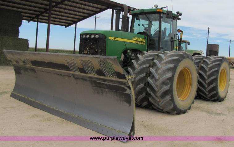 image for item 3144 2004 John Deere 9620 4WD tractor with Grouser 18' two-way blade