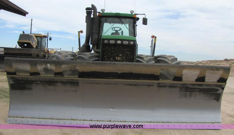 image for item 3144 2004 John Deere 9620 4WD tractor with Grouser 18' two-way blade
