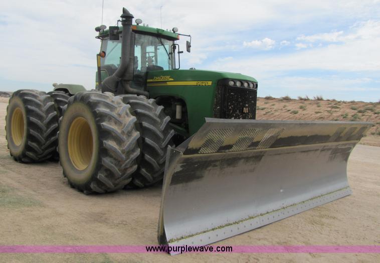 image for item 3144 2004 John Deere 9620 4WD tractor with Grouser 18' two-way blade