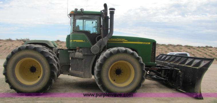 image for item 3144 2004 John Deere 9620 4WD tractor with Grouser 18' two-way blade
